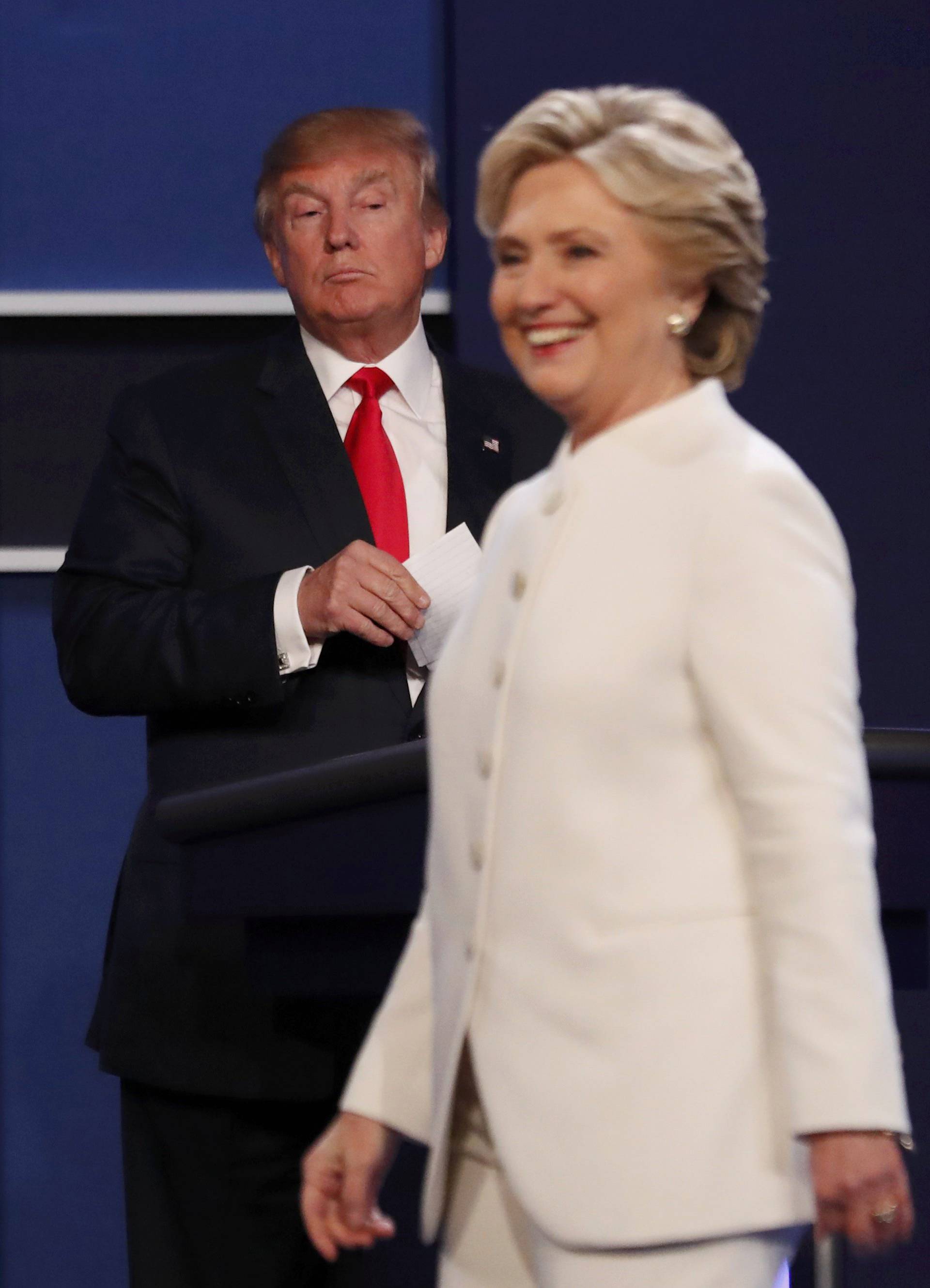 Republican U.S. presidential nominee Donald Trump and Democratic U.S. presidential nominee Hillary Clinton finish their third and final 2016 presidential campaign debate at UNLV in Las Vegas