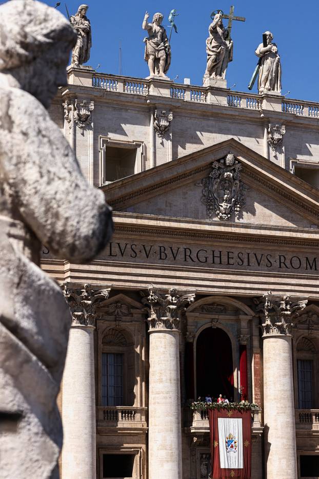 Pope Leo XIV delivers his "Urbi et Orbi" (To the city and the world) message from the main balcony of St. Peter's Basilica at the Vatican