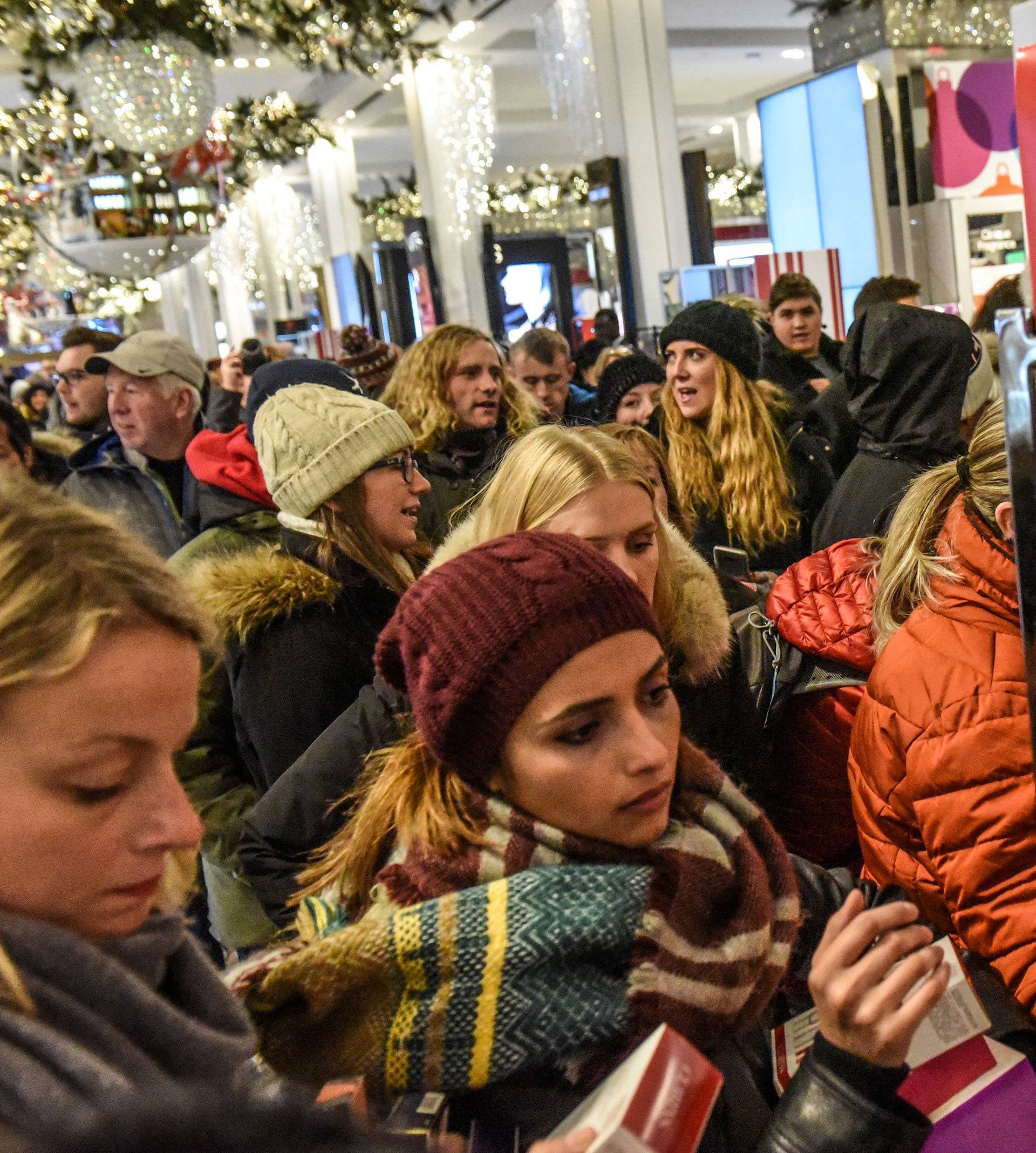 People shop during a Black Friday sales event at Macy's flagship store in New York City