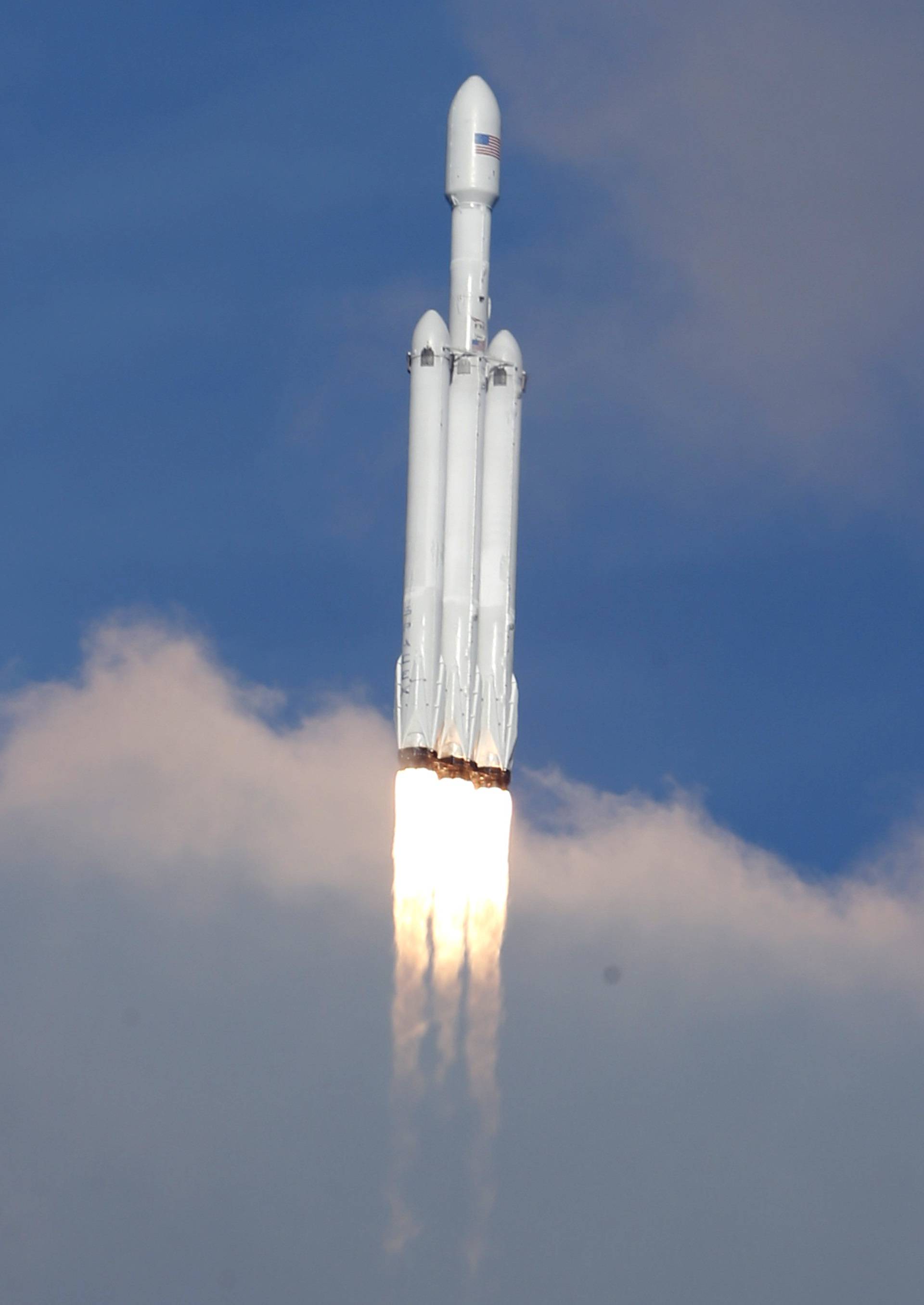 A SpaceX Falcon Heavy rocket lifts off from the Kennedy Space Center in Cape Canaveral