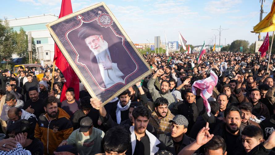 People march after Iran’s Supreme Leader Ayatollah Ali Khamenei was killed in Israeli and U.S. strikes, in Basra