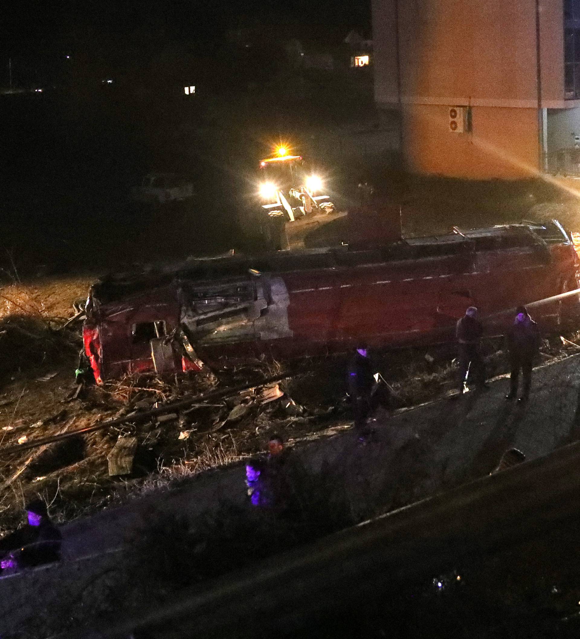 Rescue workers are seen at the site of of a bus accident, near Skopje