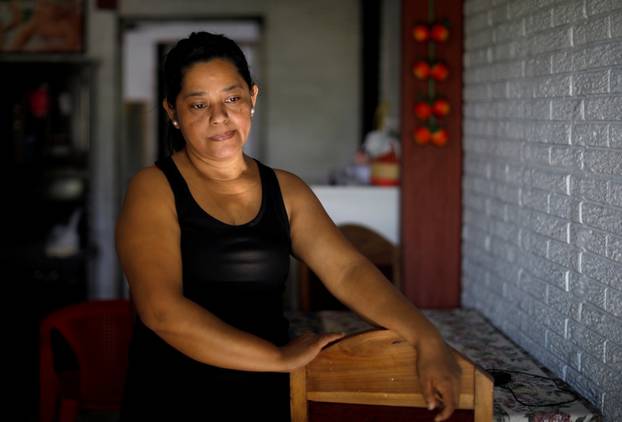 Rosa Ramirez, mother of a migrant who drowned in the Rio Grande River with his daughter during their journey to the U.S., is pictured at her house in the Altavista neighbourhood in San Martin