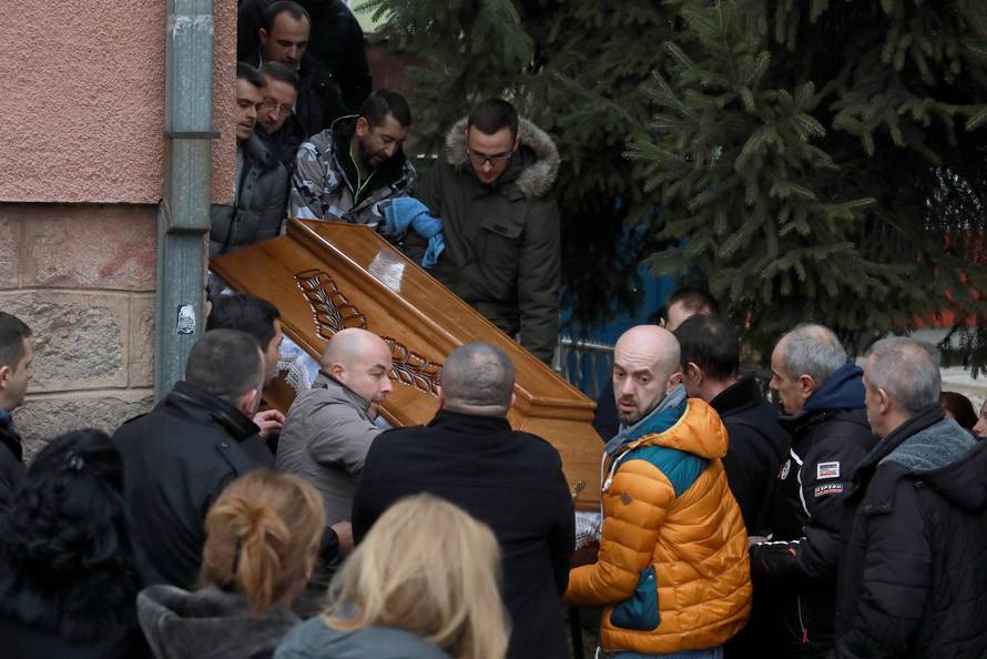 Men carry the coffin with the body of Oliver Ivanovic before cortege travel to the northern outskirts of Kosovska Mitrovica