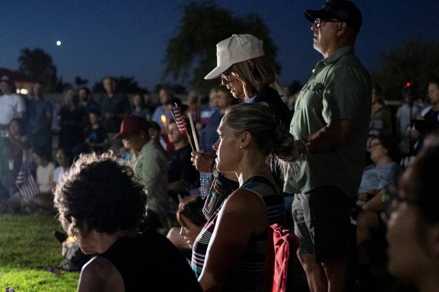 Catholics from across the Phoenix area gather to pray for Charlie Kirk, who was shot and killed in Utah, at Desert Horizon Park in Scottsdale