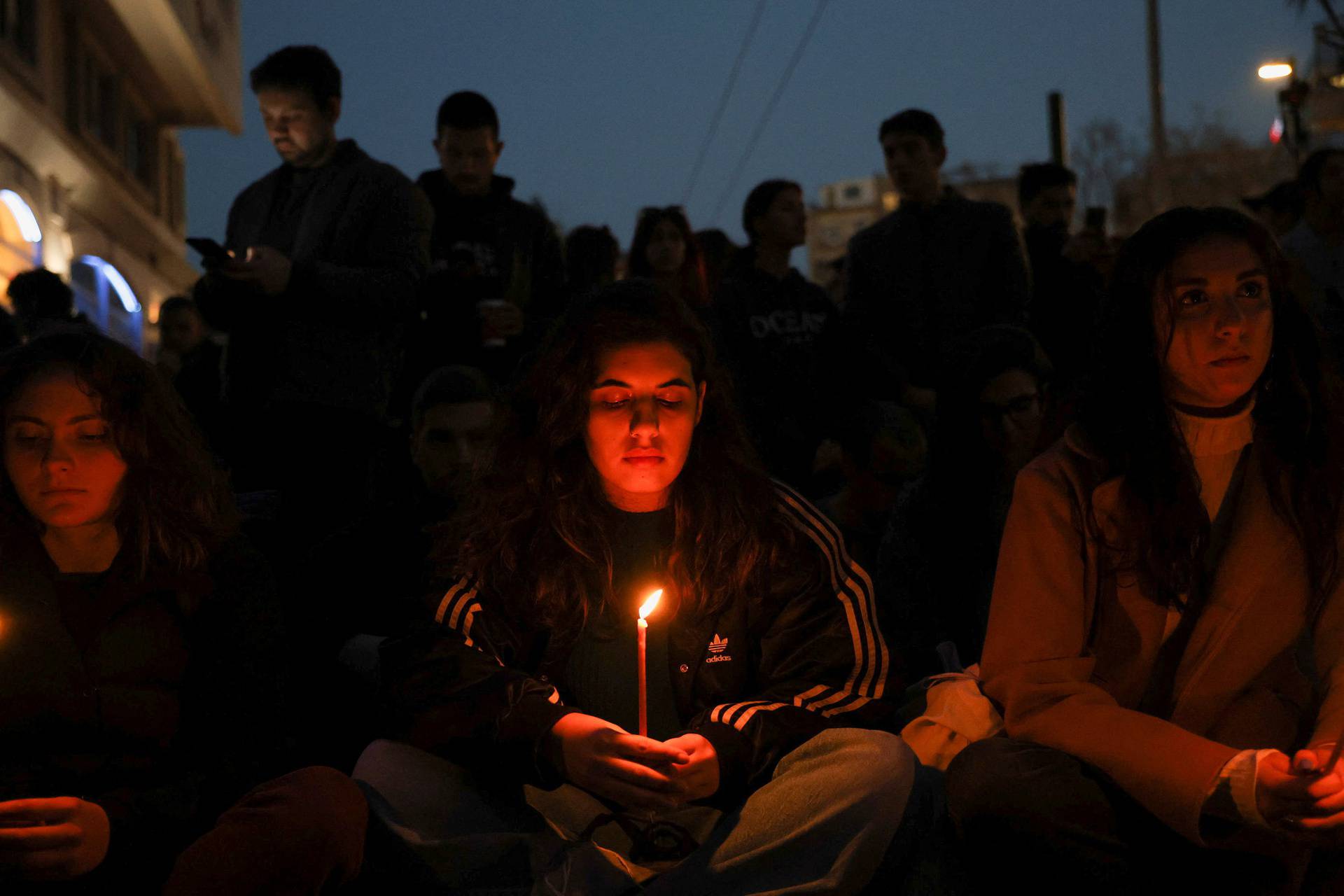 Protesters take part in a demonstration after a train crash near the city of Larissa, in Athens