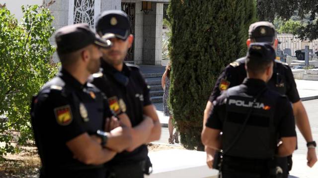 Spanish National Police officers stand near the mausoleum where late dictator Franco is expected to be buried at Mingorrubio-El Pardo cemetery in Madrid
