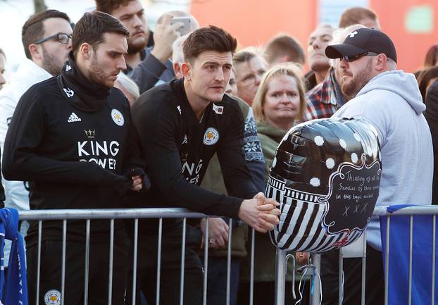 Harry Maguire and Matty James look at tributes left for Leicester City