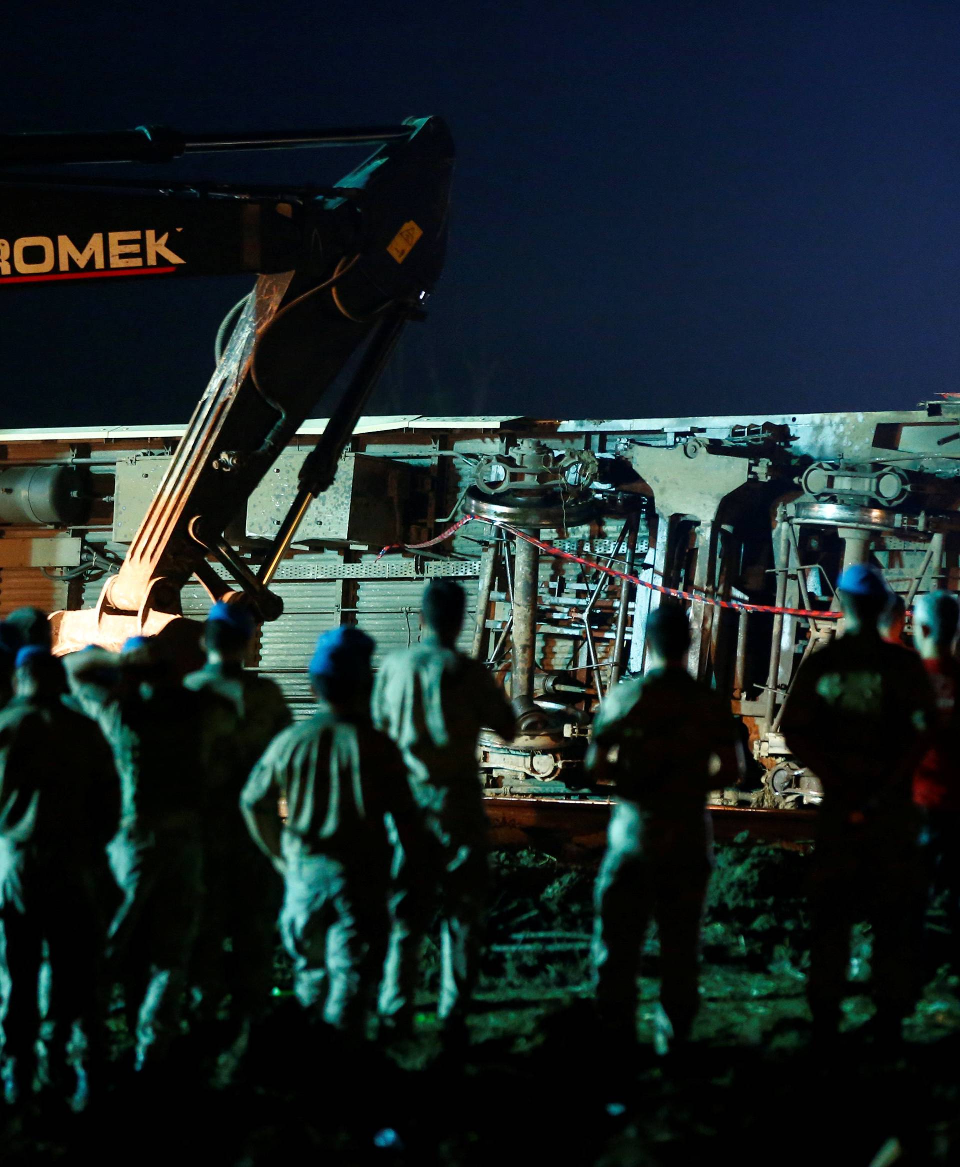 Rescue workers and paramedics work at the site of a train derailment near Corlu in Tekirdag province, Turkey