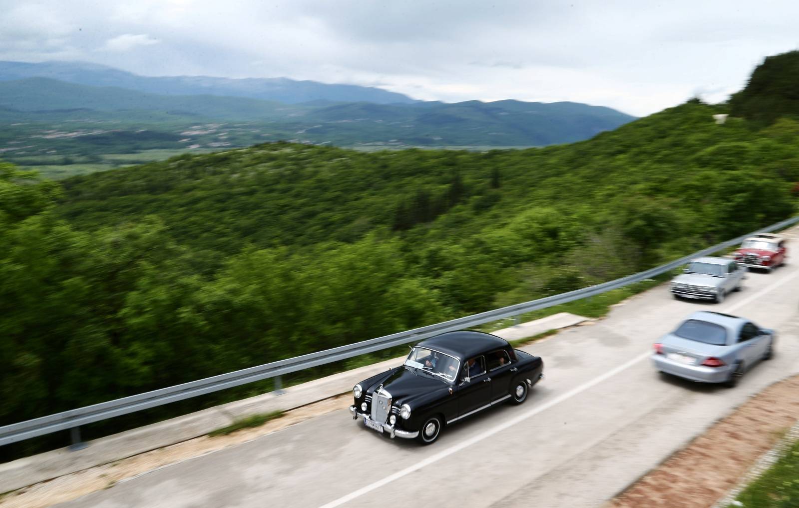 Oldtimer Mercedes cars are seen driving in Imotski