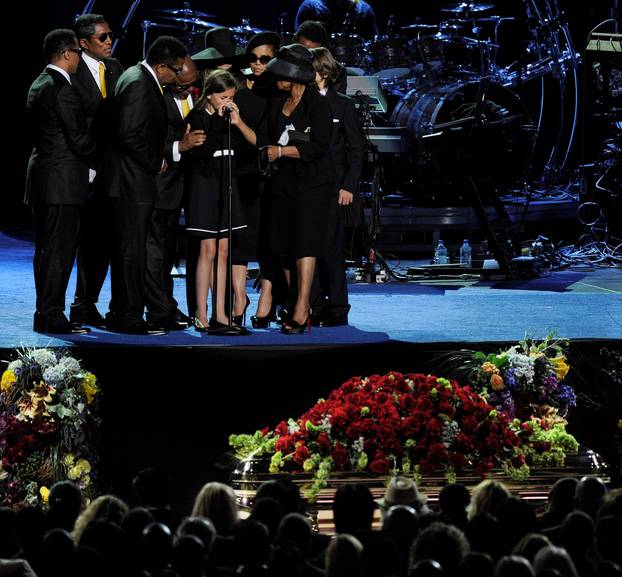 FILE PHOTO: Daughter of Michael Jackson speaks surrounded by family members at his memorial service at the Staples Center in Los Angeles