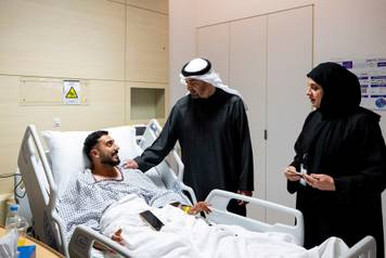 President of the United Arab Emirates meets injured patients receiving treatment at a hospital, in Abu Dhabi