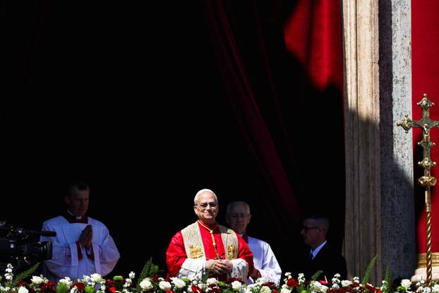 Pope Leo XIV delivers his "Urbi et Orbi" (To the city and the world) message from the main balcony of St. Peter's Basilica at the Vatican