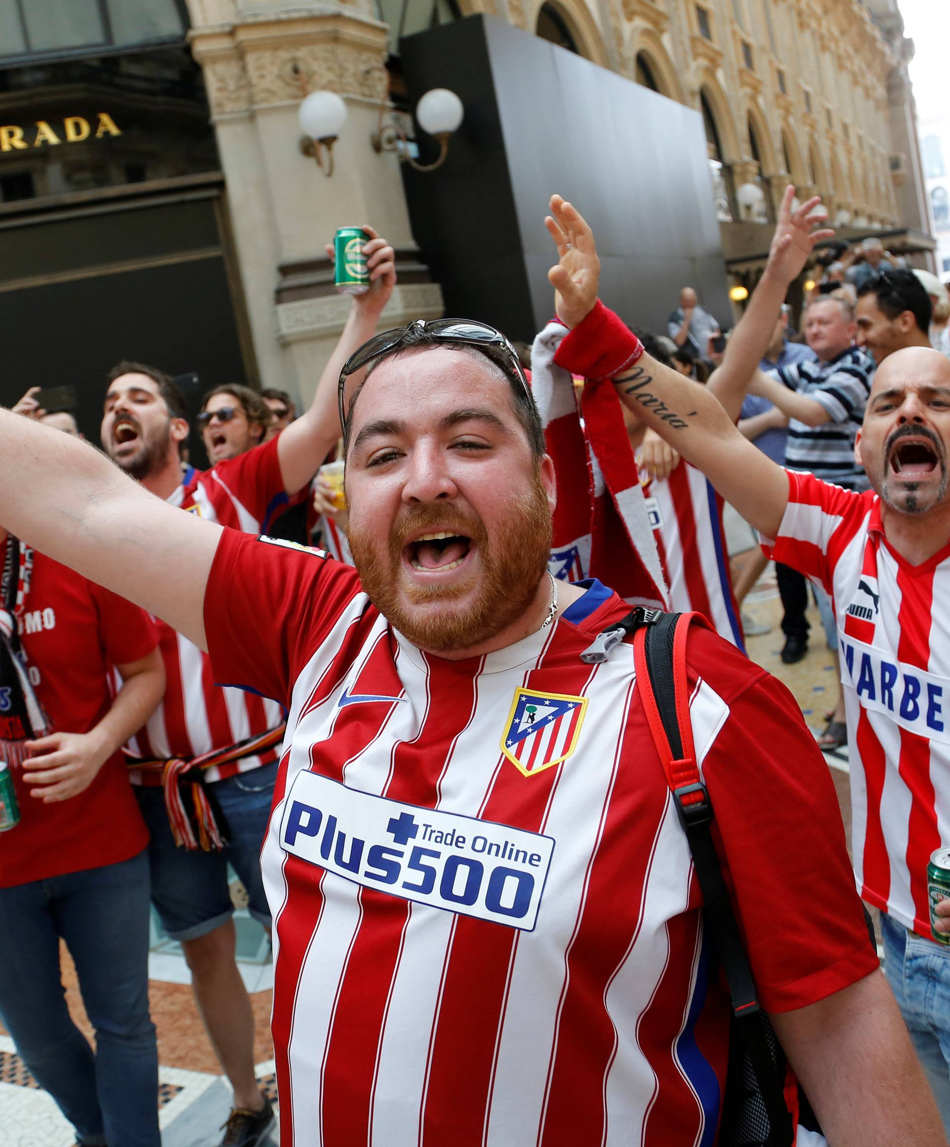 Atletico Madrid fans shout slogans before the Champions League Final between Real Madrid and Atletico Madrid in Milan