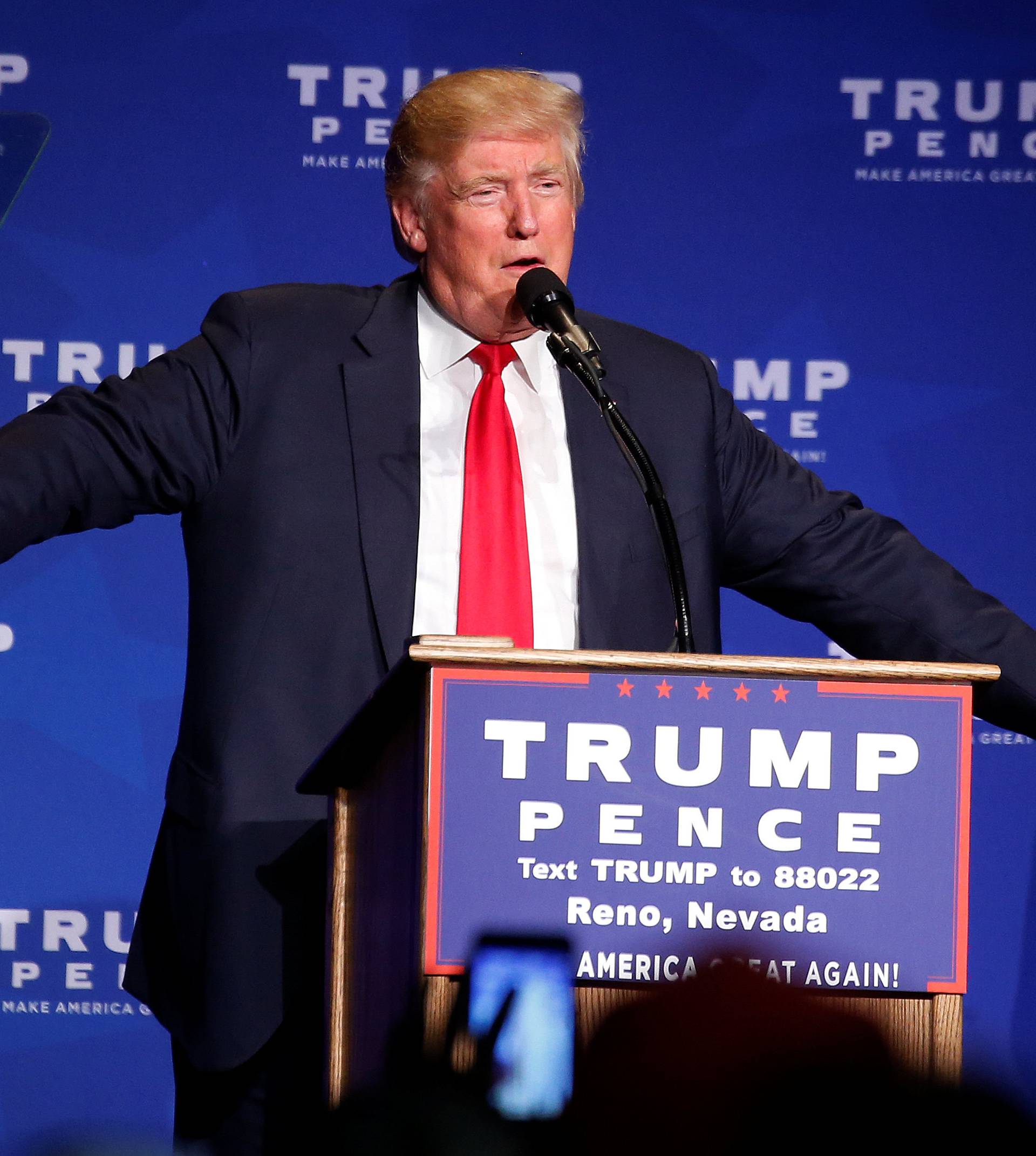 Republican presidential nominee Donald Trump discusses a security incident, where he was hustled off the stage by security agents, during a campaign rally in Reno, Nevada