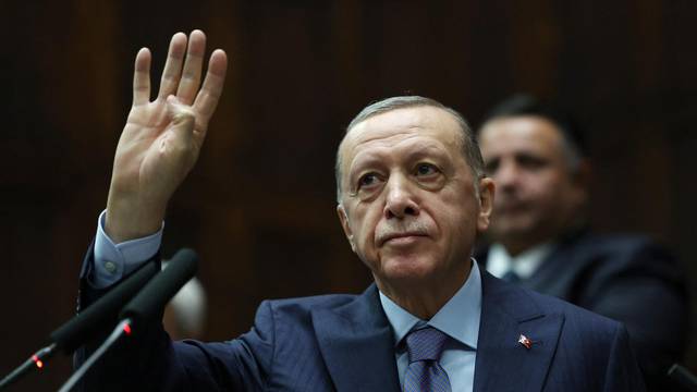 Turkey's President Tayyip Erdogan greets members of parliament in Ankara