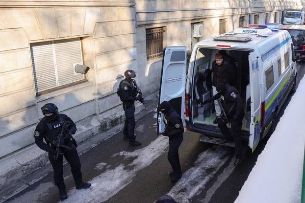 Mohamed Amra is escorted inside the Bucharest Court of Appeal