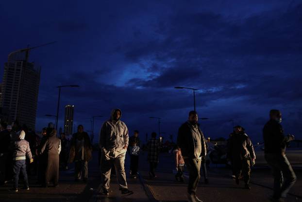 Displaced people take shelter following an escalation between Hezbollah and Israel in Beirut