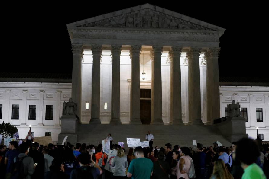 Protestors react outside the U.S. Supreme Court after the leak of a draft opinion preparing for a majority of the court to overturn the Roe v. Wade abortion rights decision in Washington