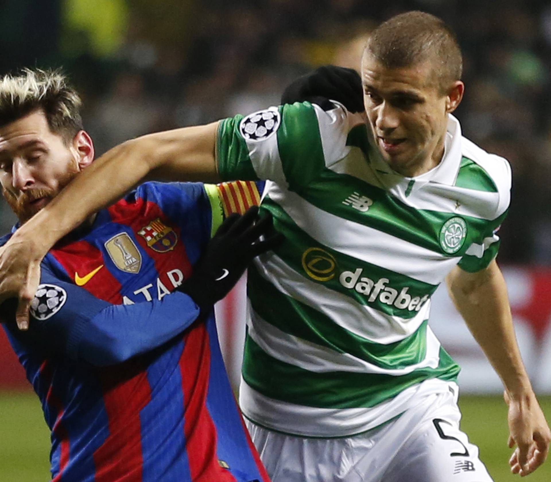 Celtic's Jozo Simunovic in action with Barcelona's Lionel Messi