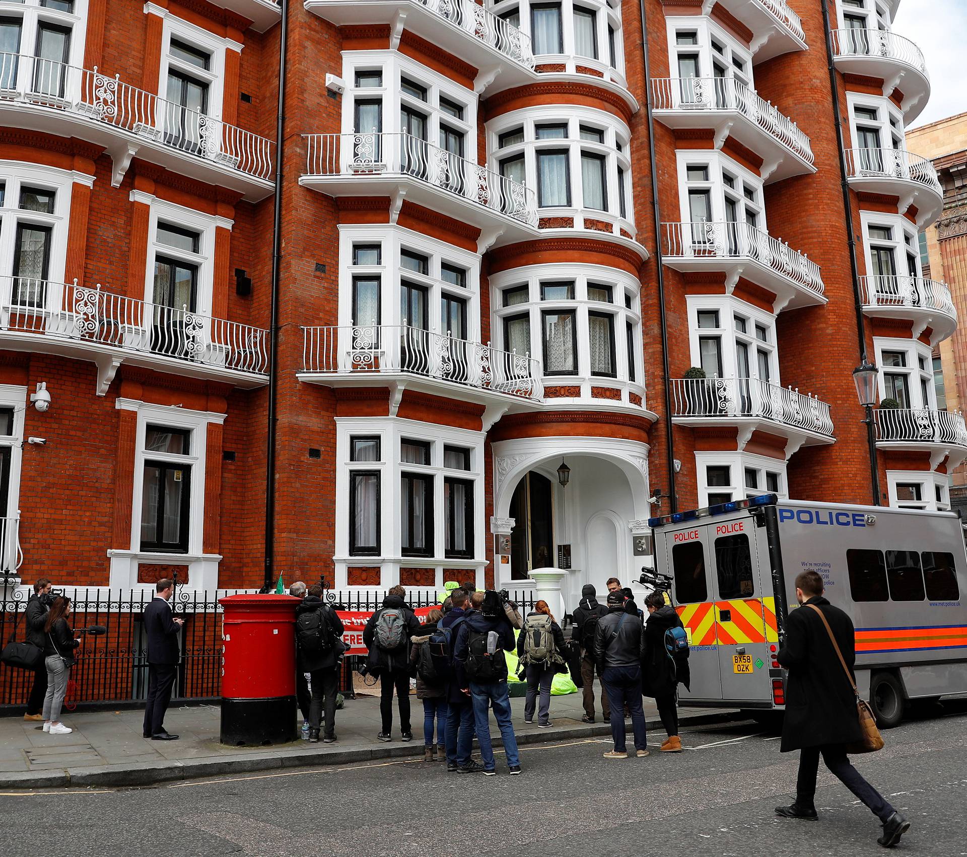 A police van is seen outside the Ecuadorian embassy after WikiLeaks founder Julian Assange was arrested by British police in London