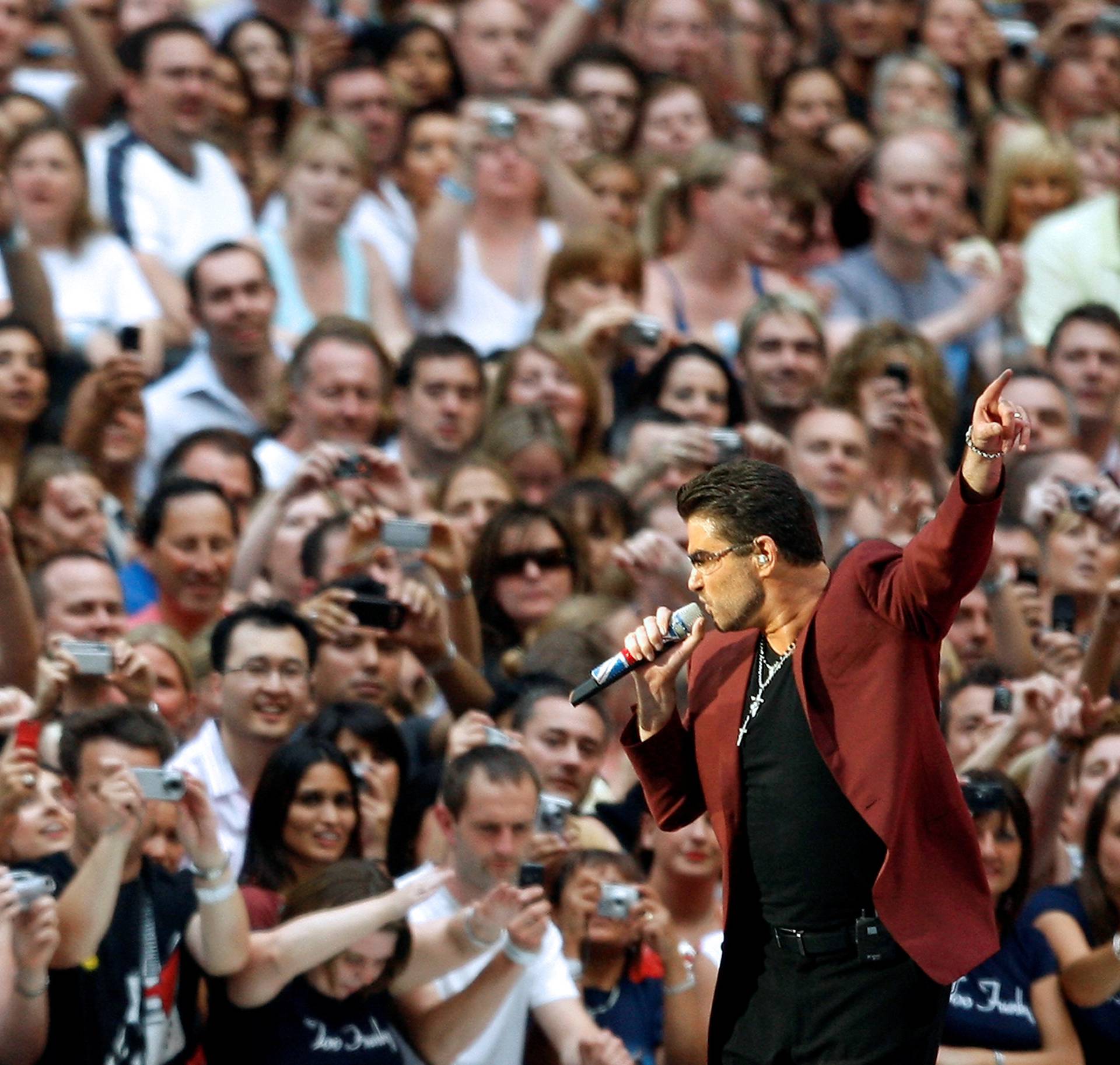 FILE PHOTO: British pop star George Michael performs during a concert at Wembley Stadium in London