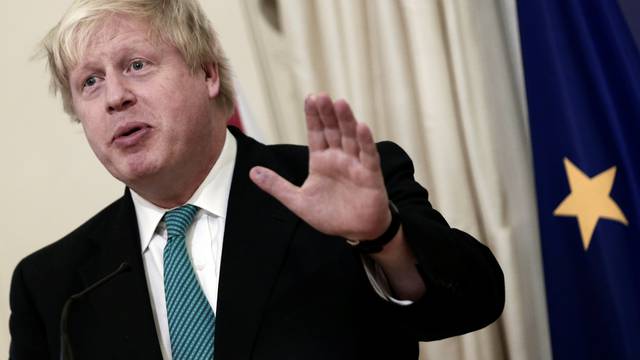 British Foreign Secretary Johnson answers a question during a joint press conference with Greek Foreign Minister Kotzias following their meeting at the Foreign Ministry in Athens