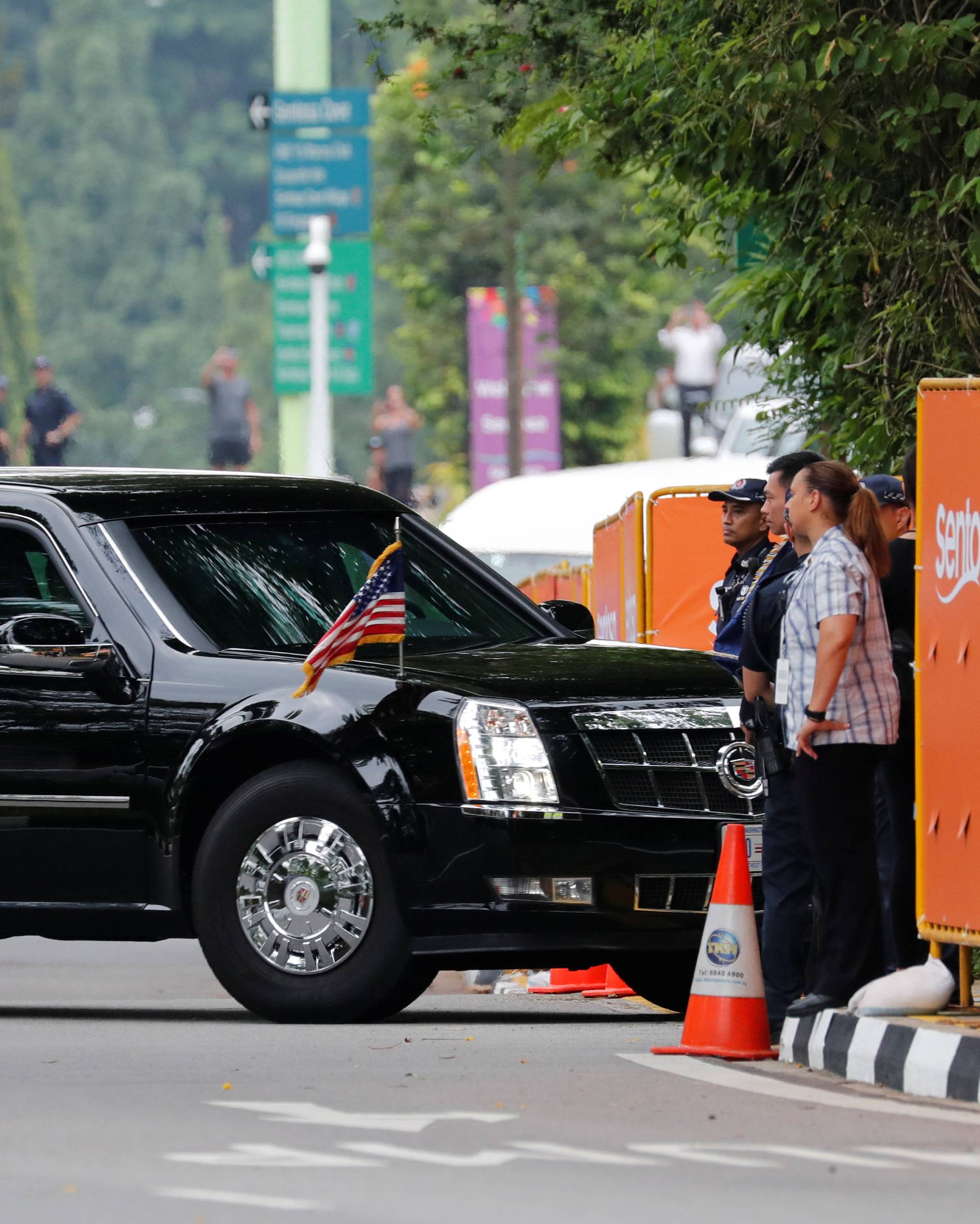 The motorcade of U.S. President Donald Trump arrives at the Capella hotel, the venue of the summit between North Korea and the U.s., on Sentosa island in Singapore