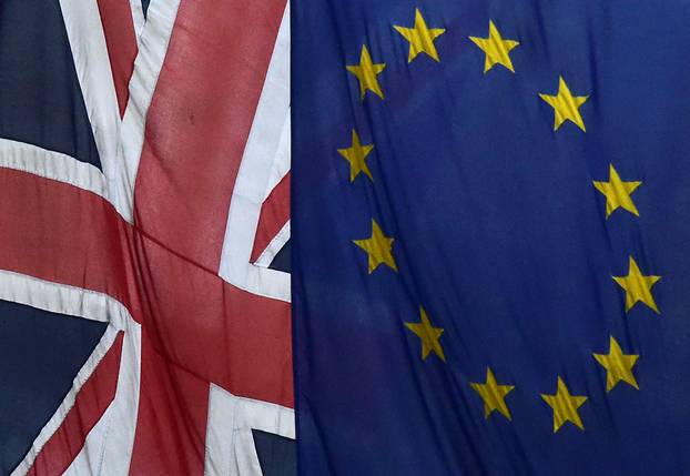 European Union and the British Union flags fly outside Europe House in London