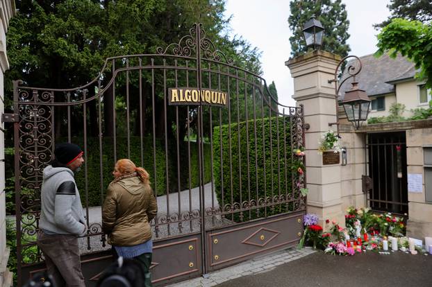 People lay flowers and candles in front of the home of late singer Tina Turner in Kuesnacht