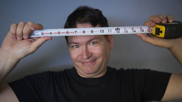 EXCLUSIVE: Jonah Falcon who has the largest penis on record at 13.5 inches (34 cm) long when erect.  Pictured is Jonah holding up items that are the same length as his 13.5 inch penis.