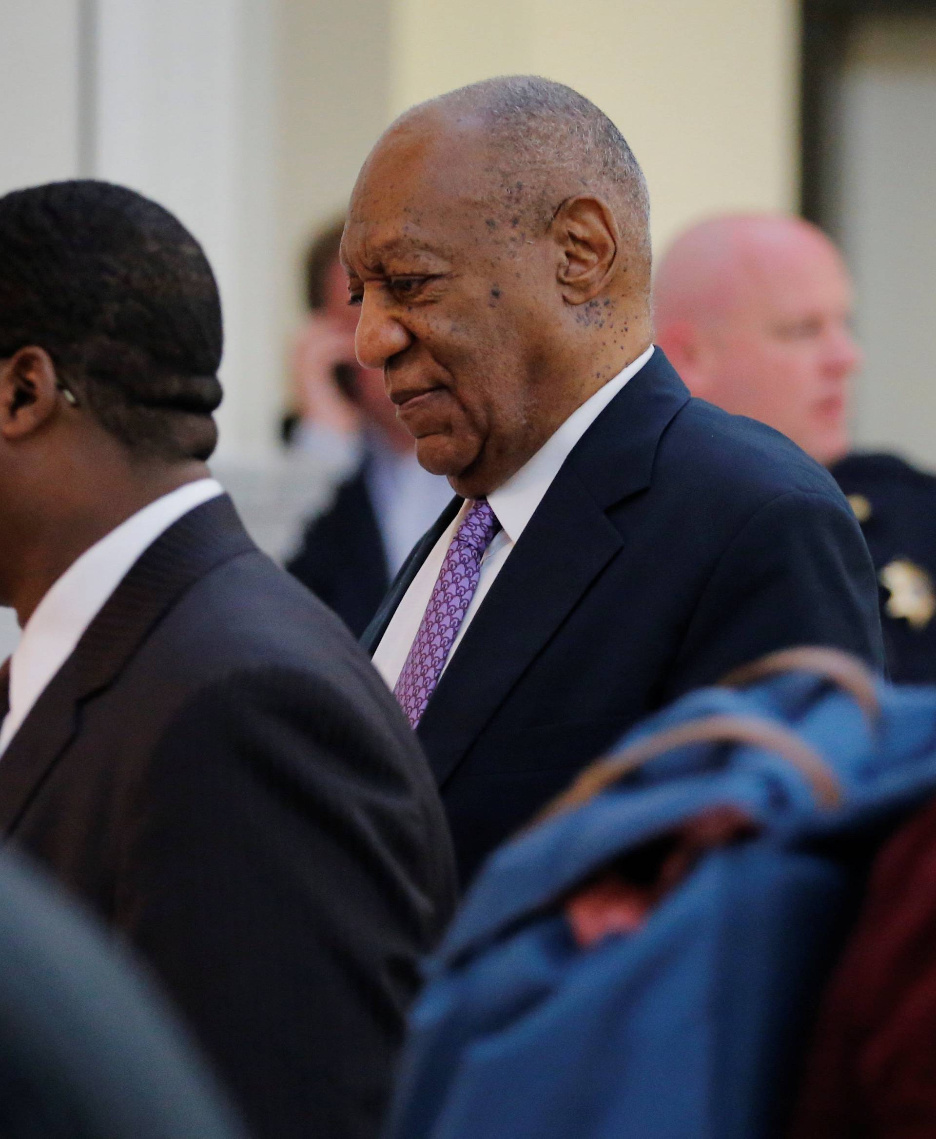Cosby walks back into the courtroom after trail break in Norristown