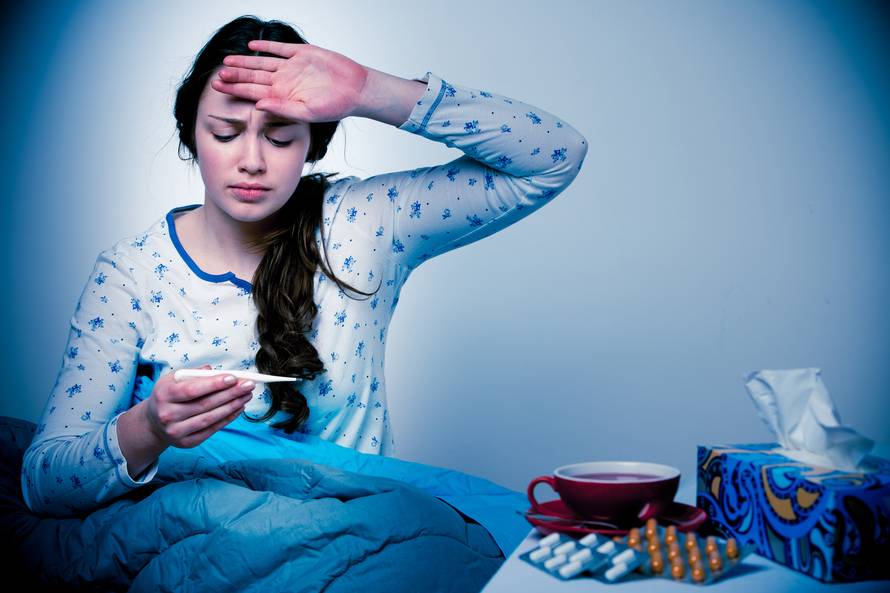 Asian caucasian woman with flu  and feaver