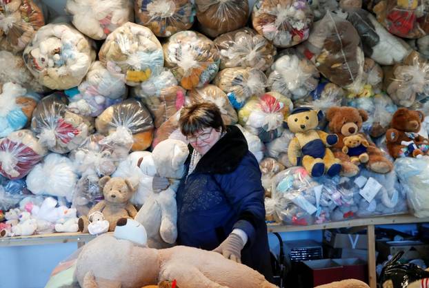 Valeria Schmidt, nicknamed as "Teddy Bear Mama", hugs a teddy bear in Harsany