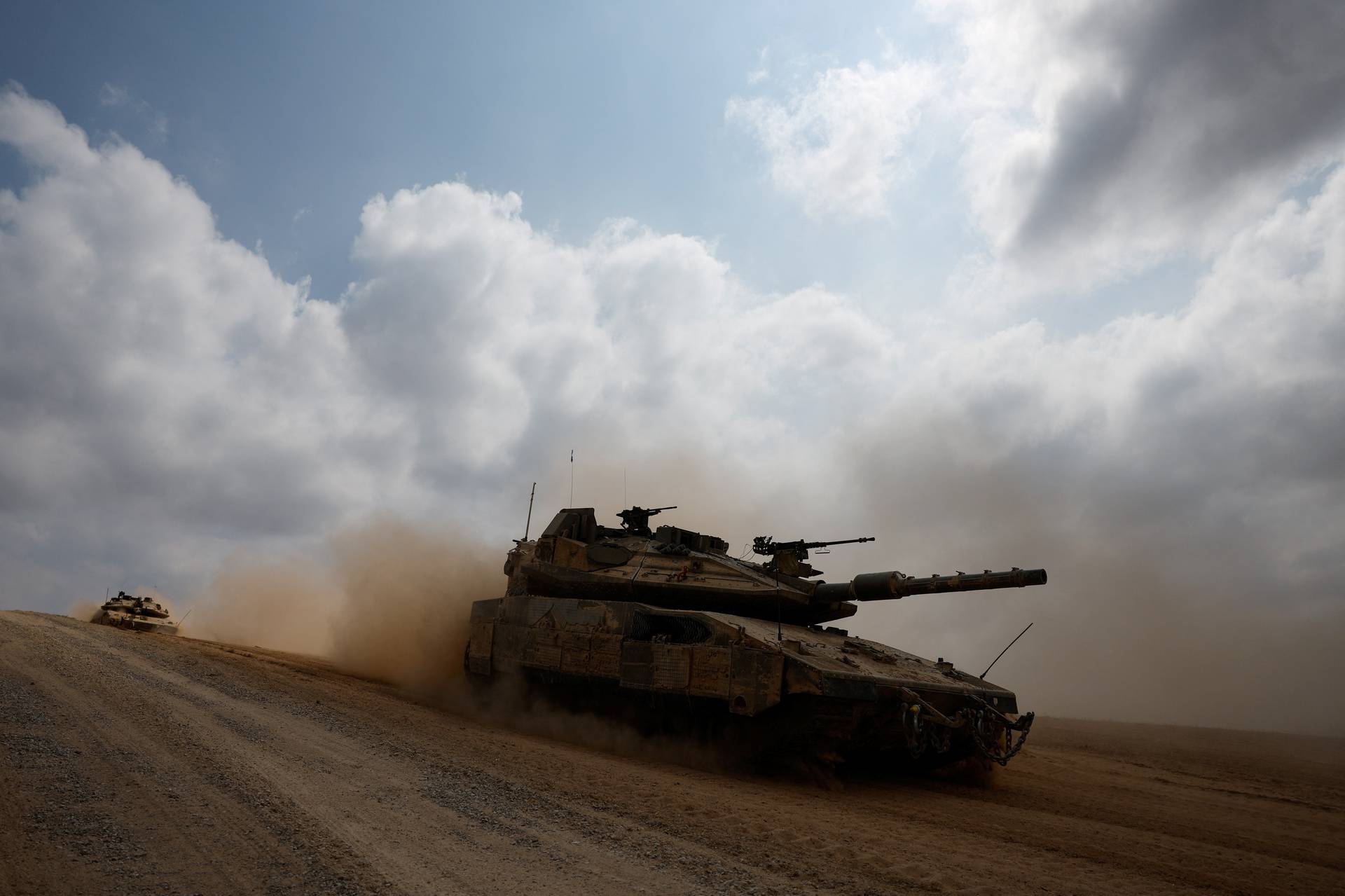 Israeli tanks manoeuvre near the Israel-Gaza border, in southern Israel