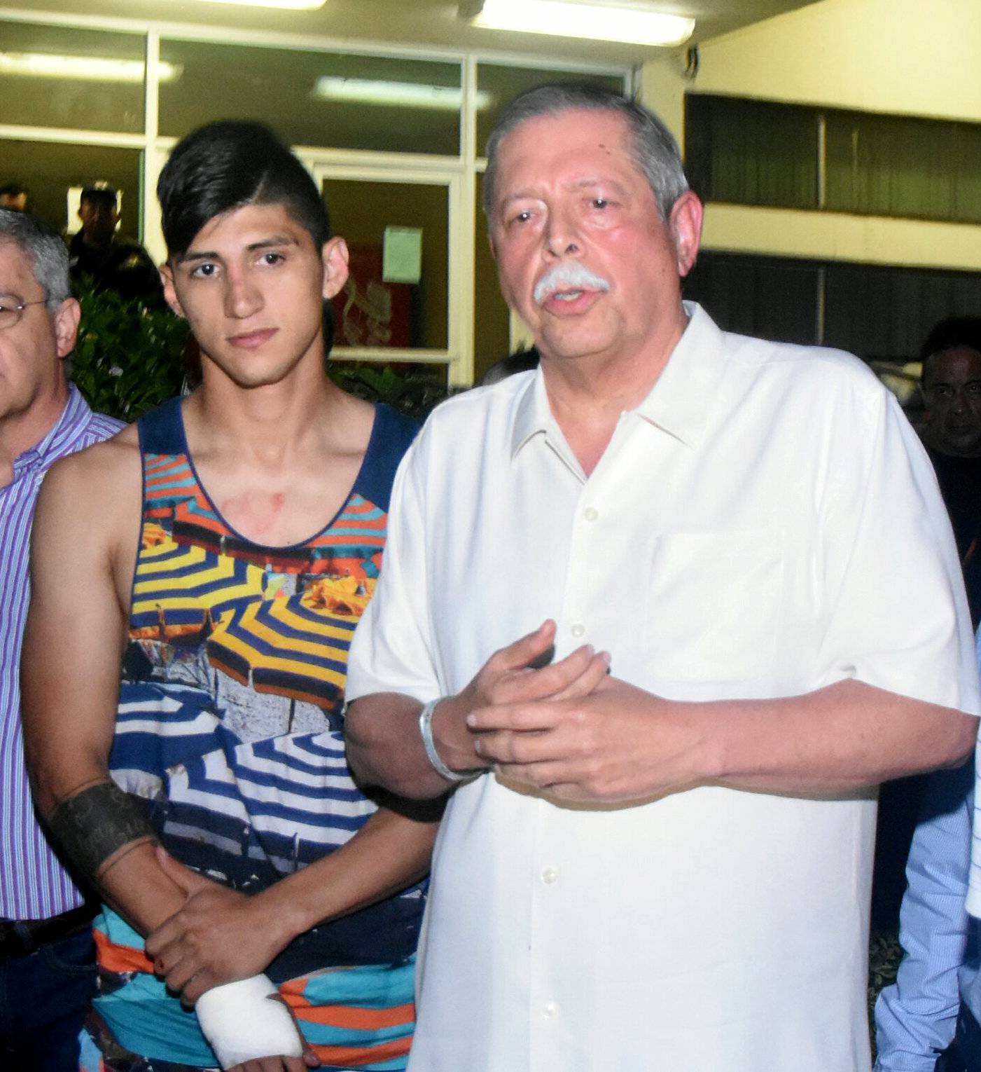 Mexico's striker Alan Pulido is seen next to Tamaulipas State Governor Egidio Torre Cantu after Pulido has been rescued within a day in Ciudad Victoria