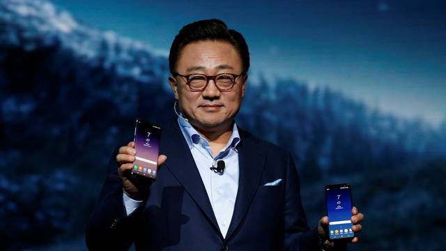 DJ Koh, Samsung president of mobile Communications, shows the Galaxy S8 and S8 + smartphones during the Samsung Unpacked event in New York