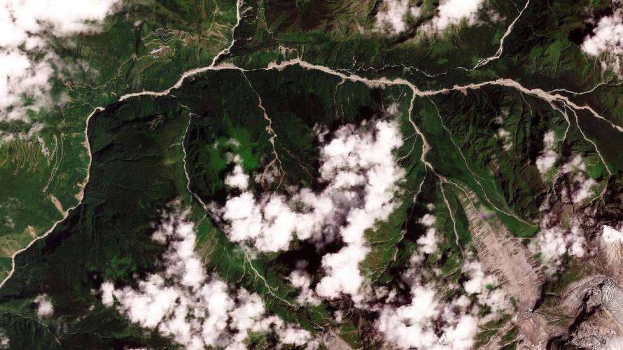 Satellite images show torrent of rock and ice high in Nepalese mountain valley after Nepal-China disaster