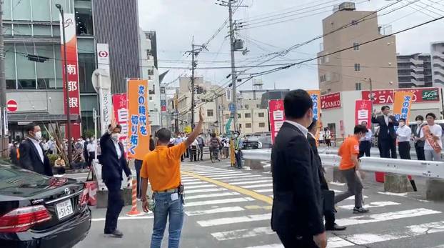 Former Japanese Prime Minister Shinzo Abe arrives for his speech in Nara