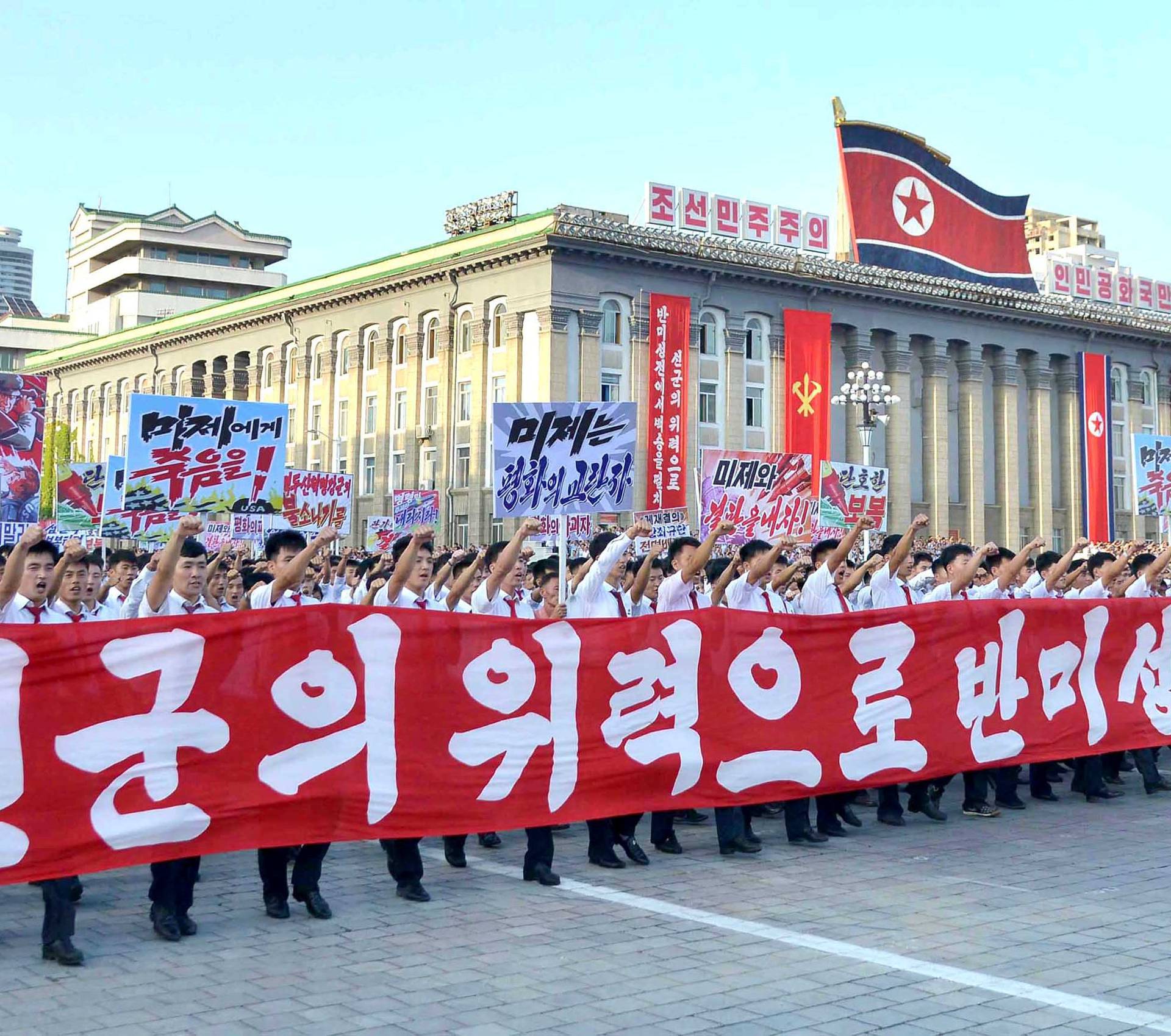 People participate in a Pyongyang city mass rally held at Kim Il Sung Square to fully support the statement of the DPRK government