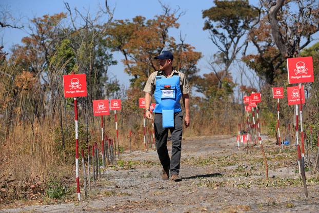 Britain's Prince Harry recreates his mother's historic landmine walk during visit to Angola