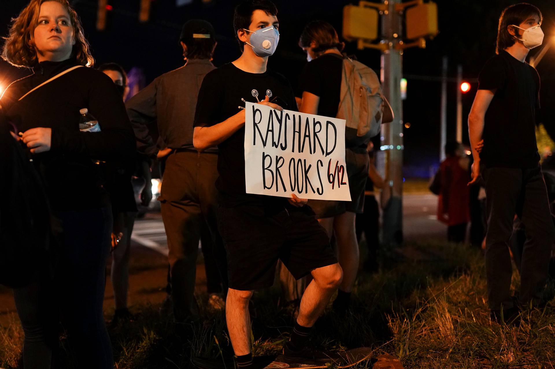 Protesters rally against racial inequality and the police shooting death of Rayshard Brooks, in Atlanta