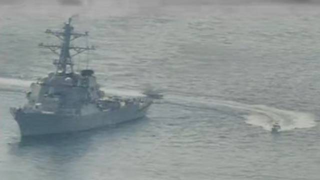 Iranian Islamic Revolutionary Guard Corps Navy vessel alongside U.S. Naval Forces in the Gulf