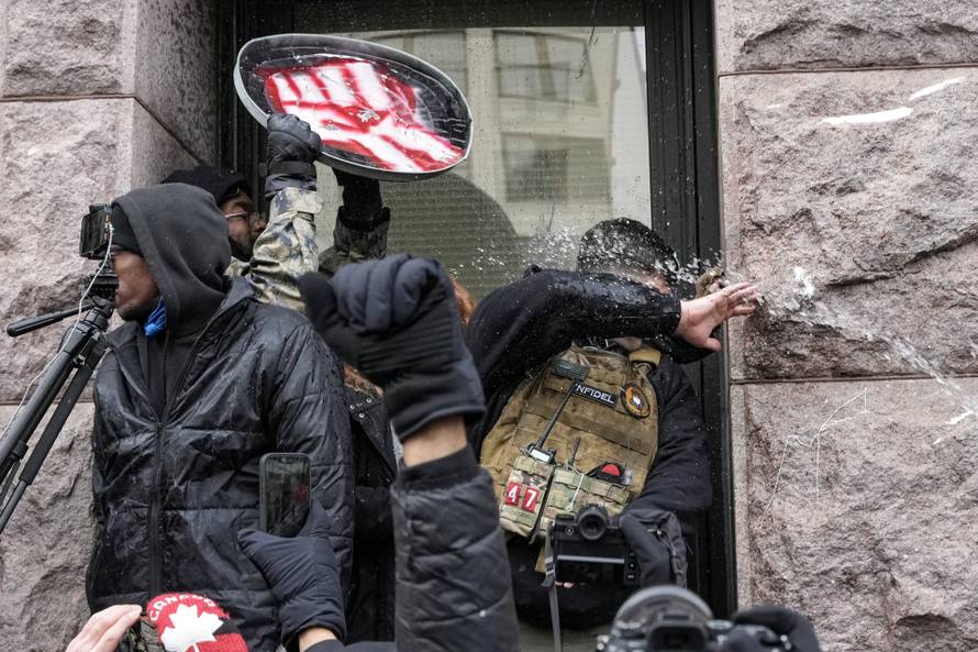 People attend the "March Against Minnesota Fraud" in Minneapolis