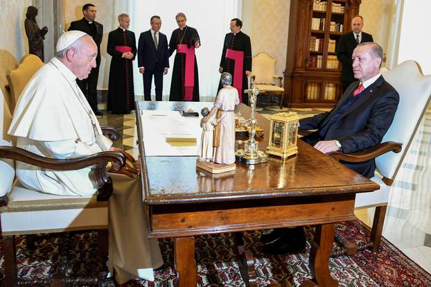 Pope Francis talks with Turkish President Tayyip Erdogan during a private audience at the Vatican