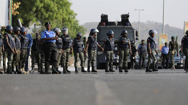 Police disrupt a rally by the #BringBackOurGirls campaign, which is protesting in Nigeria's capital Abuja to mark 1,000 days since over 200 schoolgirls were kidnapped from their secondary school in Chibok by Islamist sect Boko Haram, Nigeria