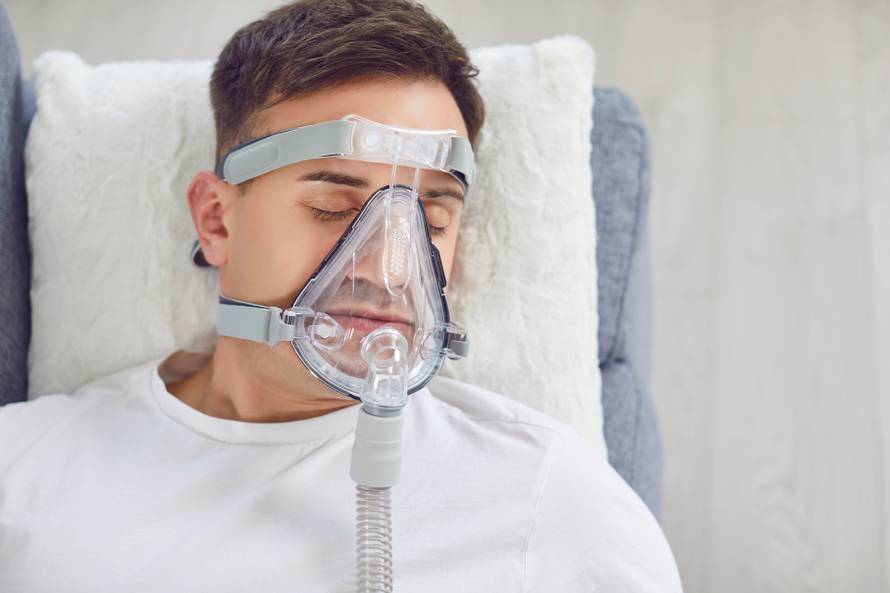 Closeup,From,Above,Sick,Man,With,A,Medical,Oxygen,Mask