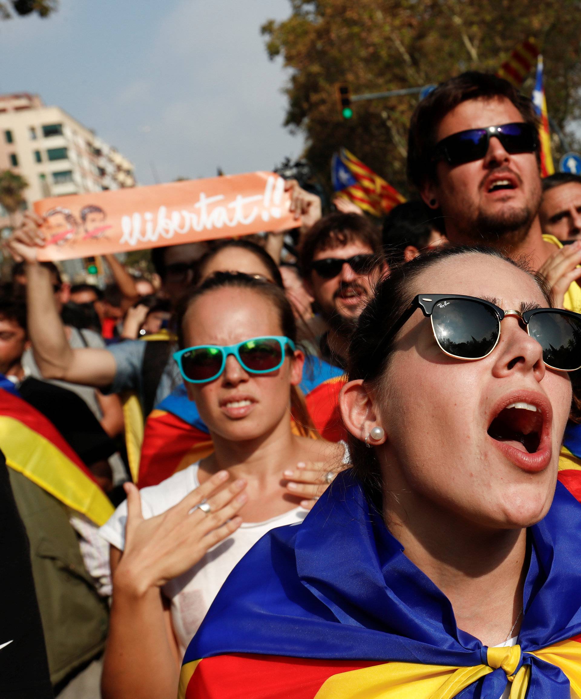 People celebrate after the Catalan regional parliament declares the independence from Spain in Barcelona