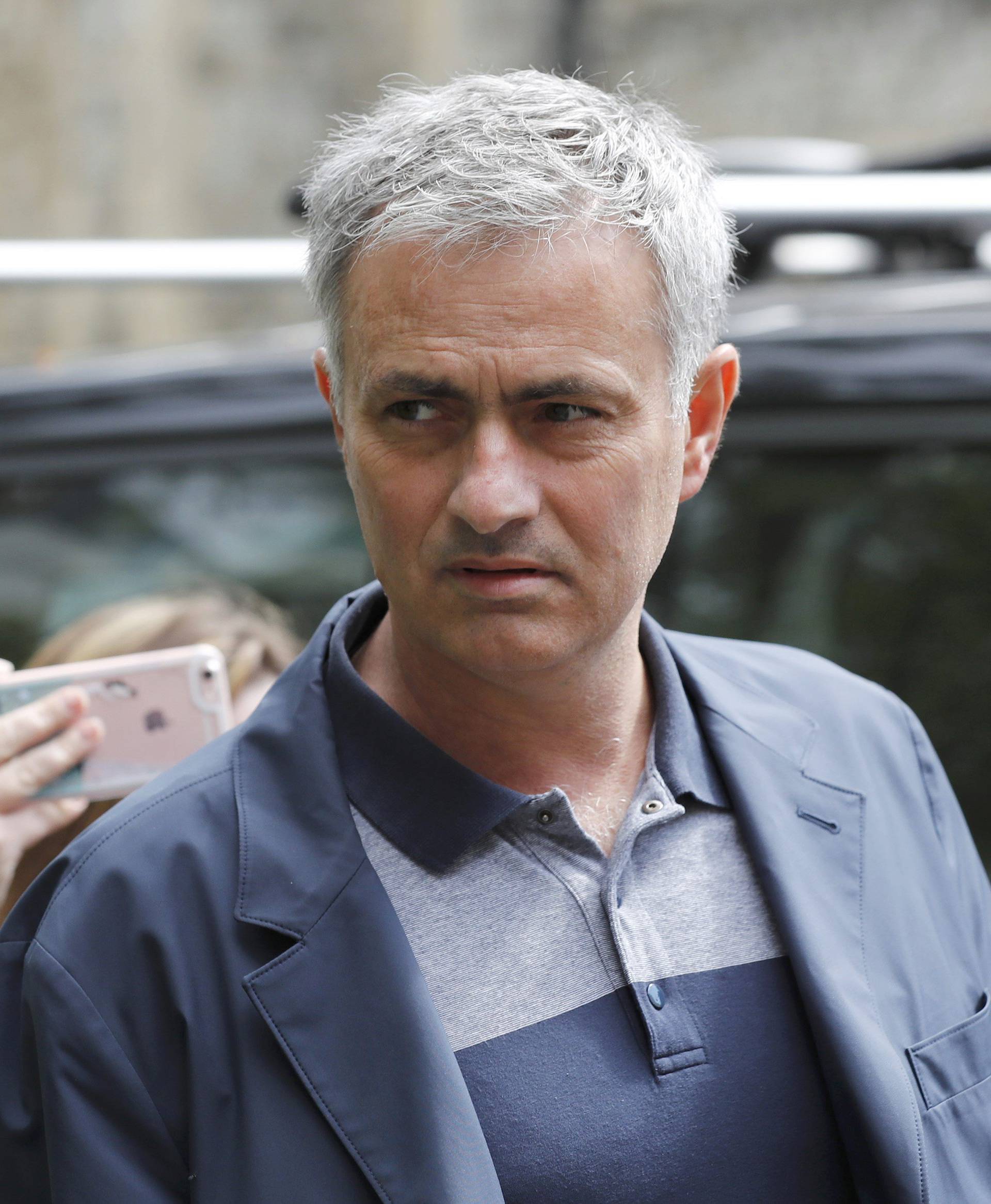 Former Chelsea manager Jose Mourinho walks to his house in London