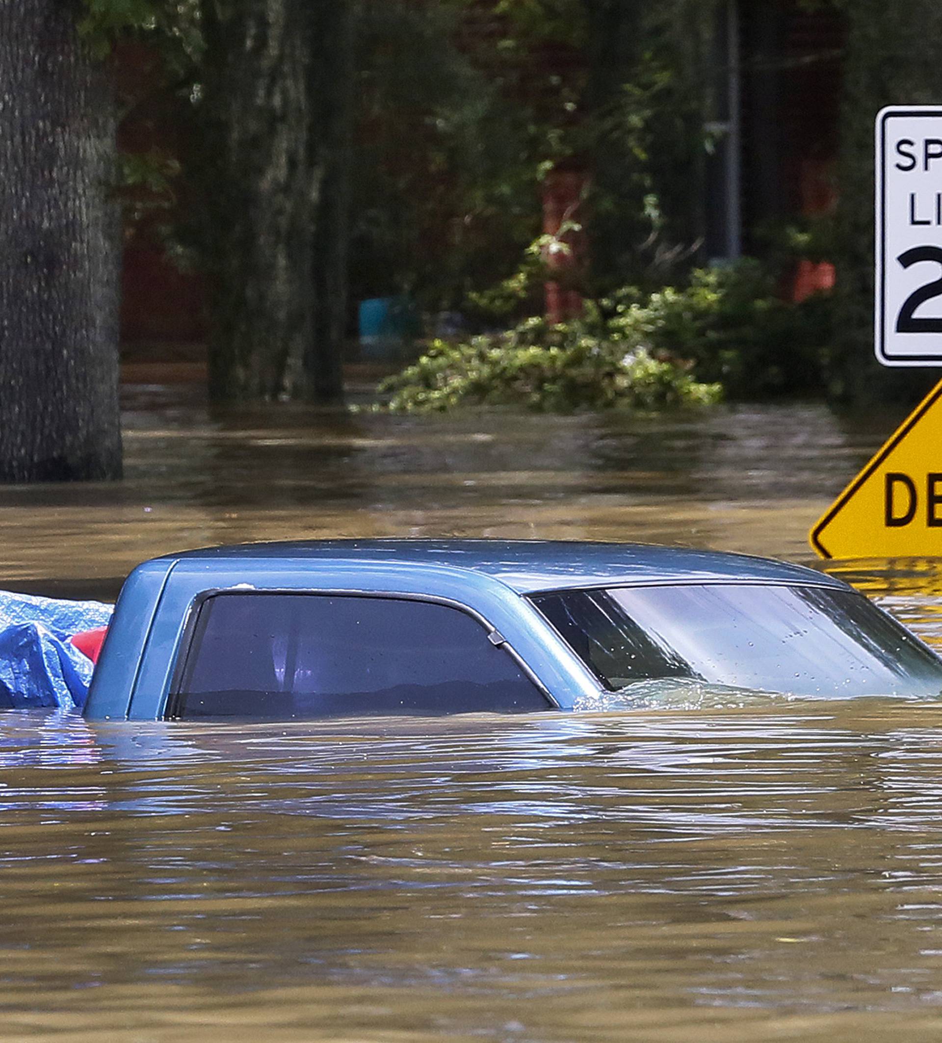 A submerged vehicle is seen in Ascension Parish